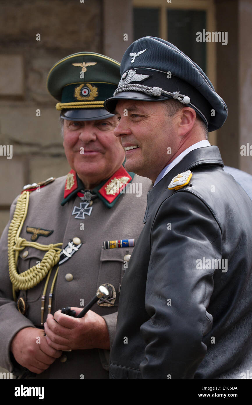 German Army Officers in costume at Ramsbottom, Lancashire, UK. 26th May, 2014.   Nazi insignia or Nazi uniforms worn by participants dressed up as German army soldiers in Nazi Regalia at the East Lancashire Railway’s award-winning 1940s Weekend.  Organisers of the three-day 1940s Wartime Weekend have imposed strict new policies prohibiting Nazi regalia, military, german, war, soldier, badge, germany, symbol, 1945, flag, medal, victory, award, collection, insignia, object, service, star, success, union, belt, buckle, veteran,  following an outcry over their use at previous festivals. Stock Photo
