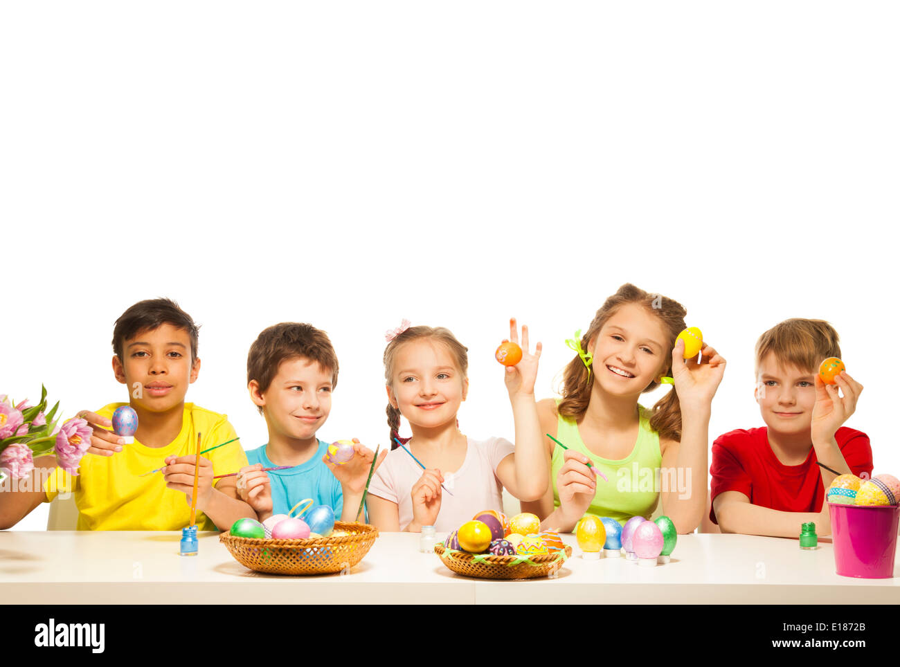 Five funny children with colourful Eastern eggs Stock Photo