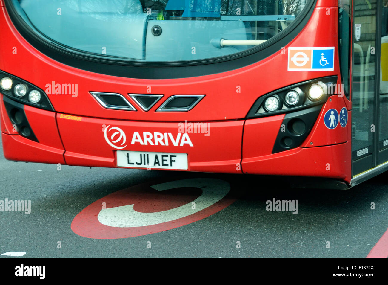 Bus crossing over congestion marking sign printed on road Stock Photo