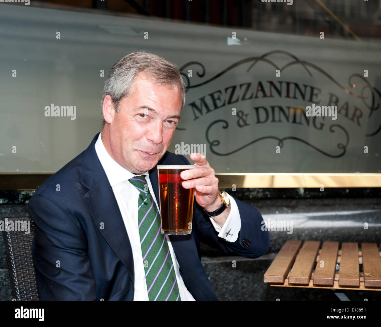 London, UK, 26th May, 2014. Nigel Farage enjoys his first Victory pint outside Nicholson pub, The Feathers Broadway Street London. He went with UKIP Team to celebrate MEP election victory May 2014 Credit:  Prixpics/Alamy Live News Stock Photo
