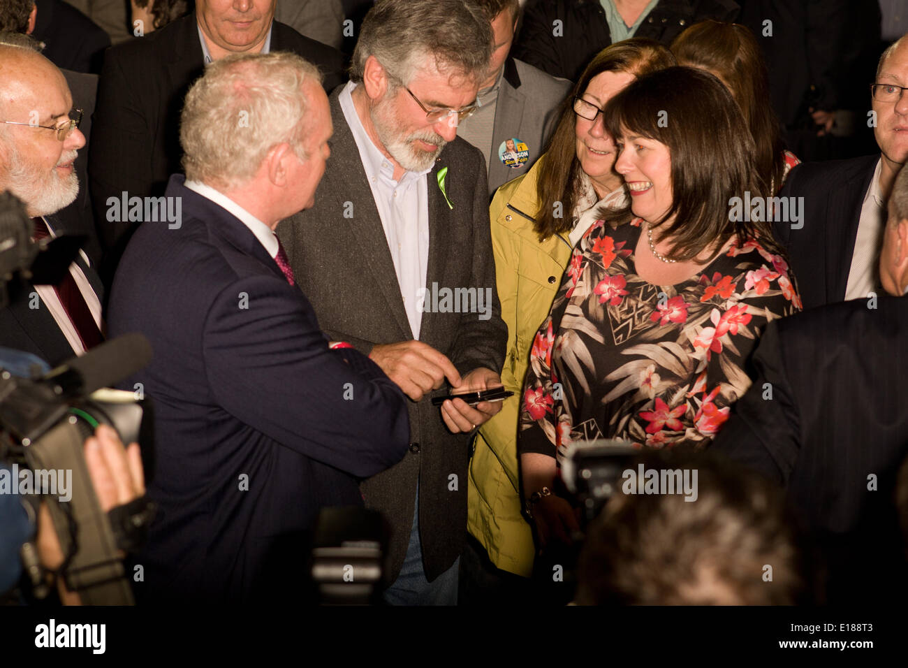 Belfast, UK. 26th May, 2014. Gerry Adams Texting with Martin McGuinness and Michelle Gildernew at European Election Results in Belfast Credit:  Bonzo/Alamy Live News Stock Photo