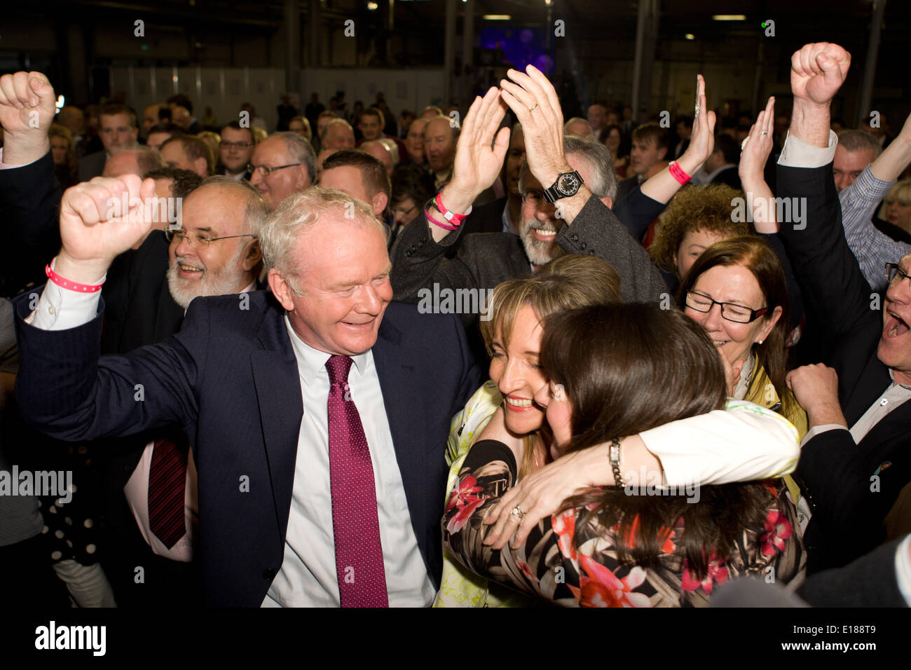 Belfast, UK. 26th May, 2014. Martin McGuinness's arms in air with Martina Anderson MEP and Michelle Gildernew at European Election Results in Belfast Credit:  Bonzo/Alamy Live News Stock Photo