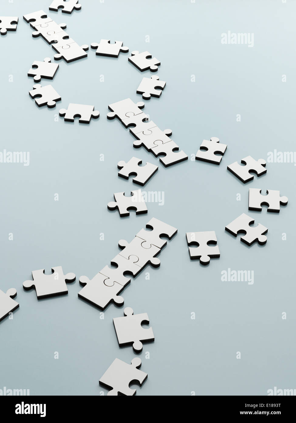 Connecting jigsaw pieces Stock Photo
