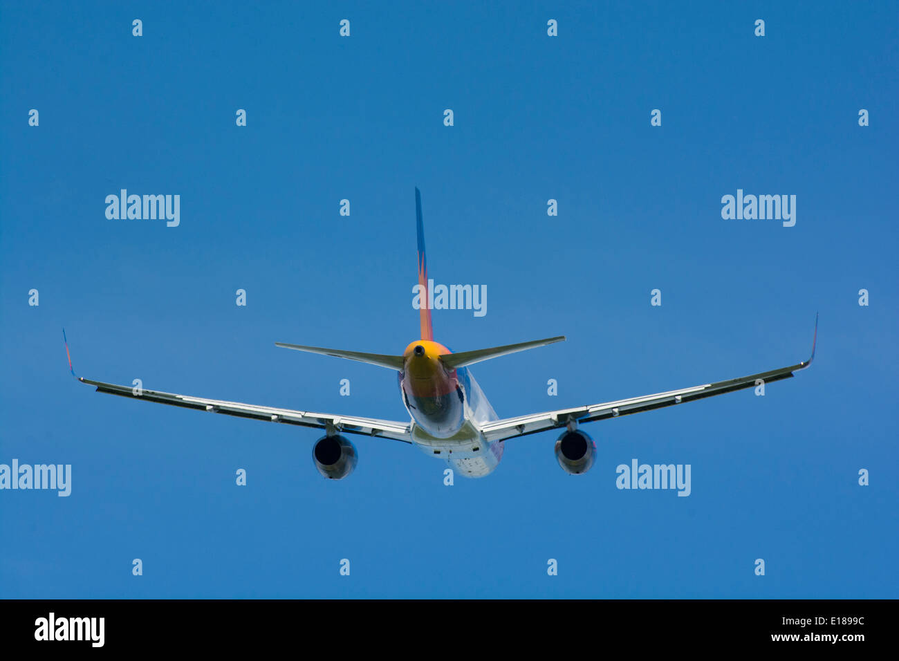 Passenger jet in flight Stock Photo