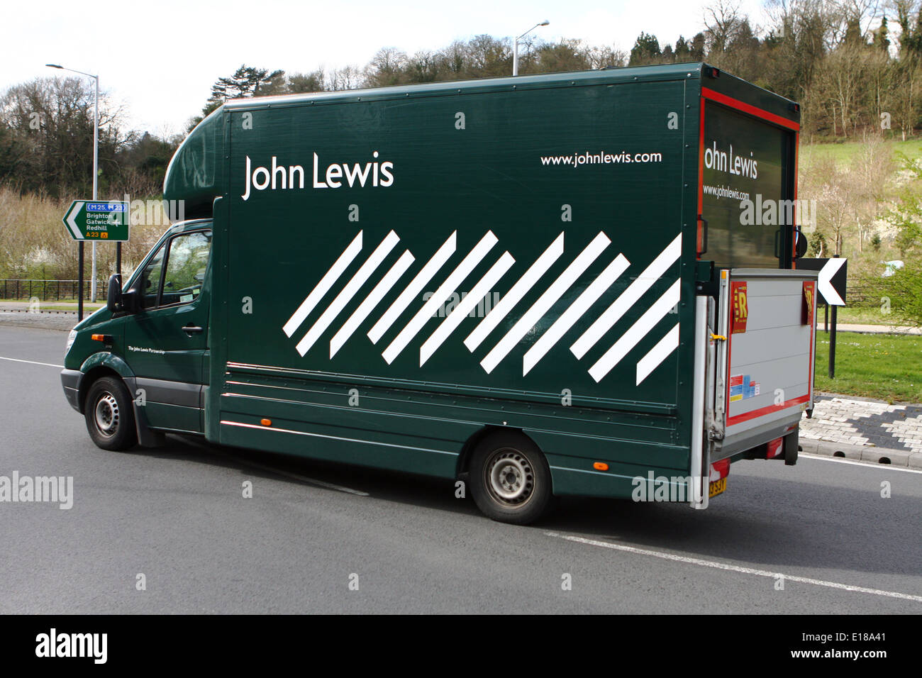 A John Lewis truck traveling around a roundabout in Coulsdon, Surrey, England Stock Photo