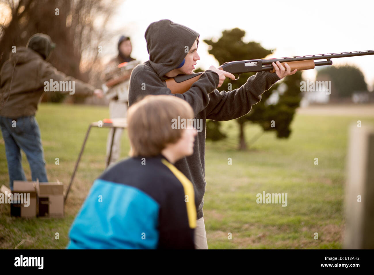 Young men shooting clays in Bel Air, Maryland,USA Stock Photo