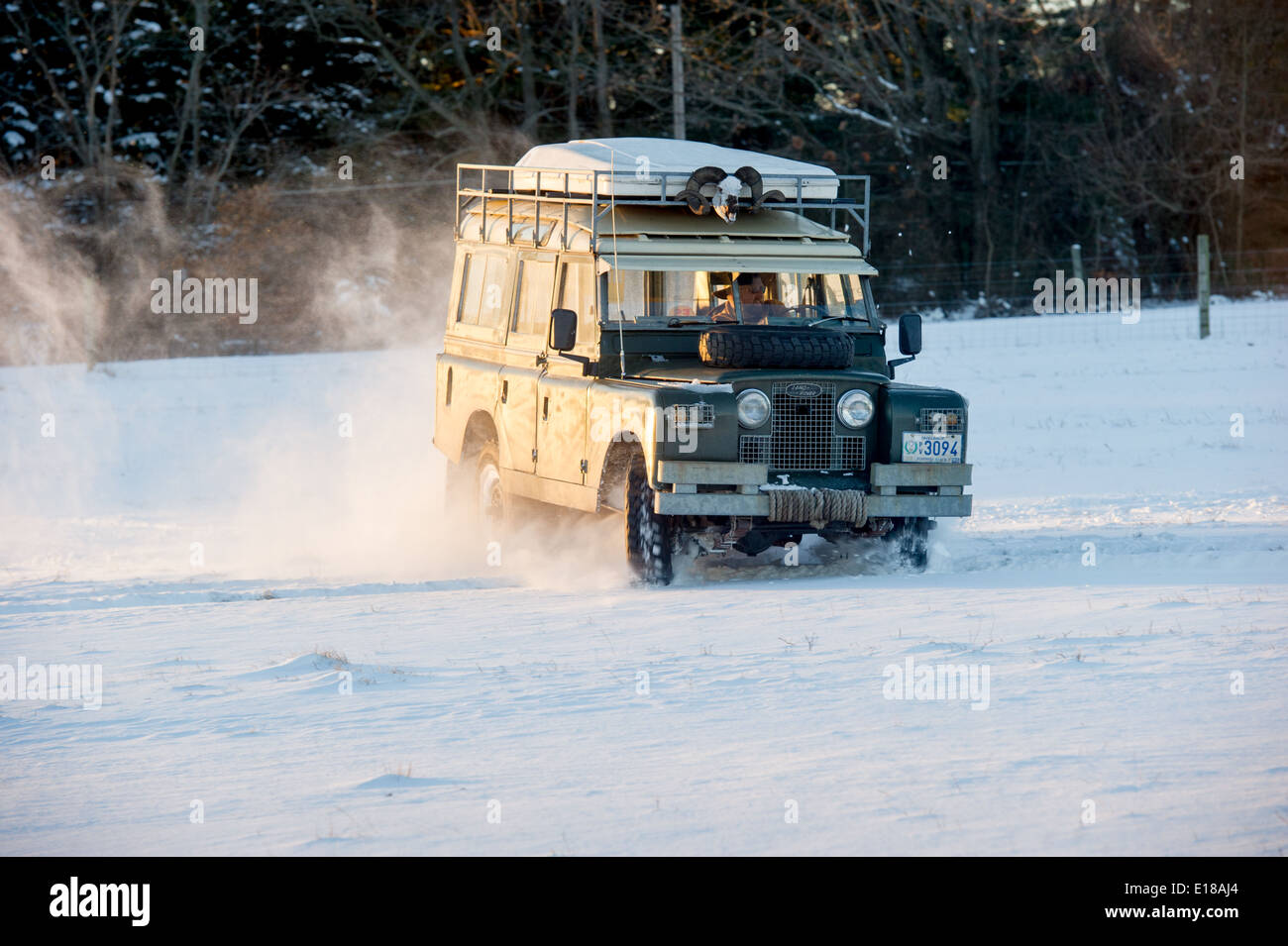 Land Rover Series 2a driving in snow. Fallston, Maryland, USA Stock Photo