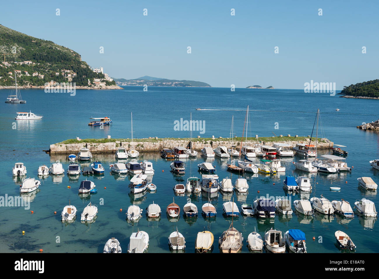 View across the harbour with boats in the foreground and the sea in the background, Dubrovnik, Croatia Stock Photo
