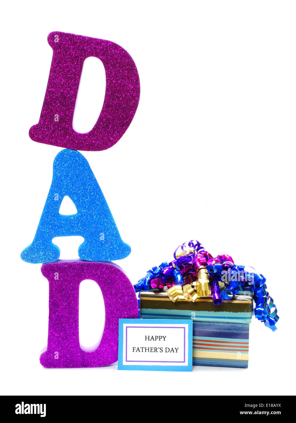 Shiny letters spelling DAD with gift box and Happy Fathers Day tag Stock Photo