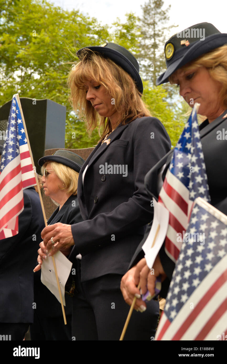 Merrick, New York, U.S. - May 26, 2014 - R-L, DEBRA BERNHARDT and MARGARET BIEGELMAN, members of the Merrick American Legion Auxiliary Post 1282, participate in The Merrick Memorial Day Parade and Ceremony. They bowed their heads during a Moment of Silence, for those who died in war while serving in the United States military. Credit:  Ann E Parry/Alamy Live News Stock Photo