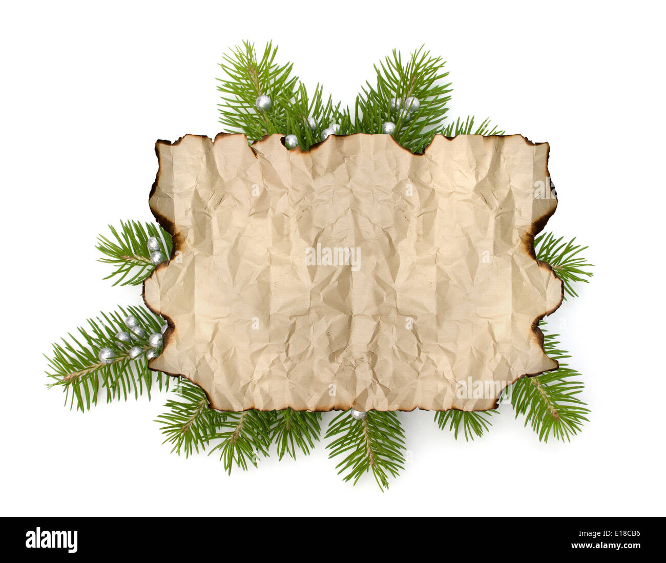 https://c8.alamy.com/comp/E18CB6/old-parchment-paper-with-copy-space-on-christmas-tree-branch-background-E18CB6.jpg