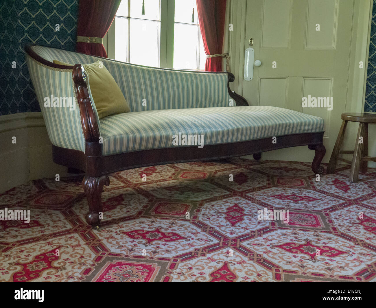 vintage couch green white strip colborne lodge Stock Photo