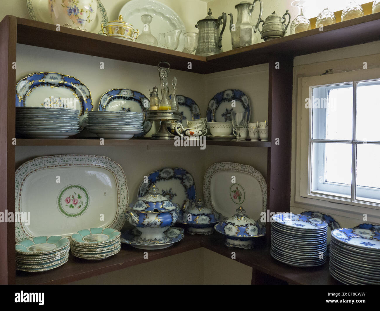 vintage kitchenware plate bowl on wooden shelf at colborne lodge Stock Photo