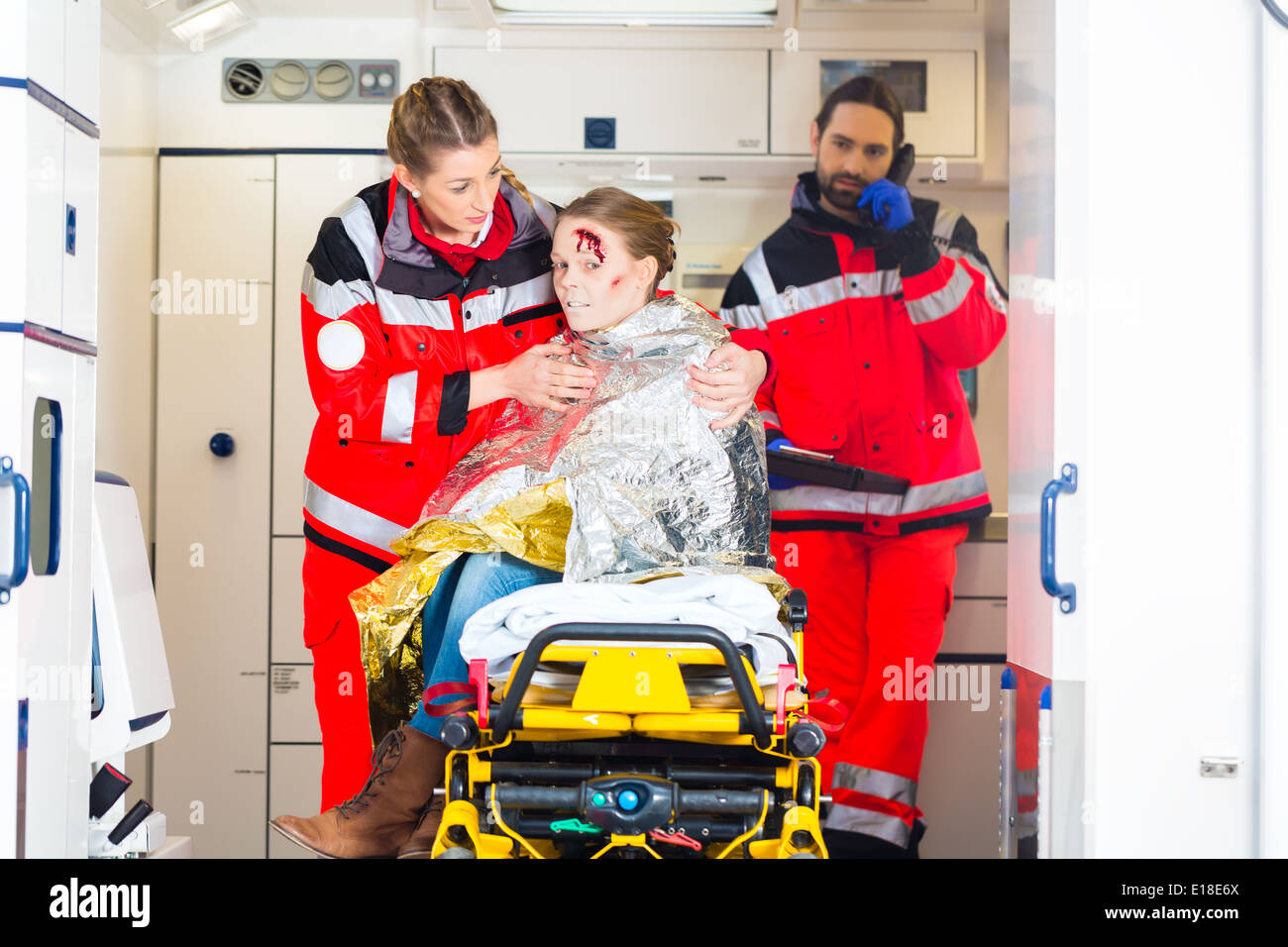 Emergency doctor and paramedic or ambulance team helping accident victim Stock Photo Alamy