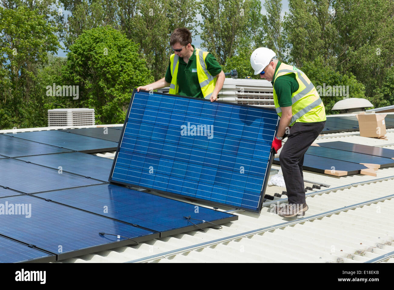 photovoltaic solar panels being installed on a roof Stock Photo Alamy