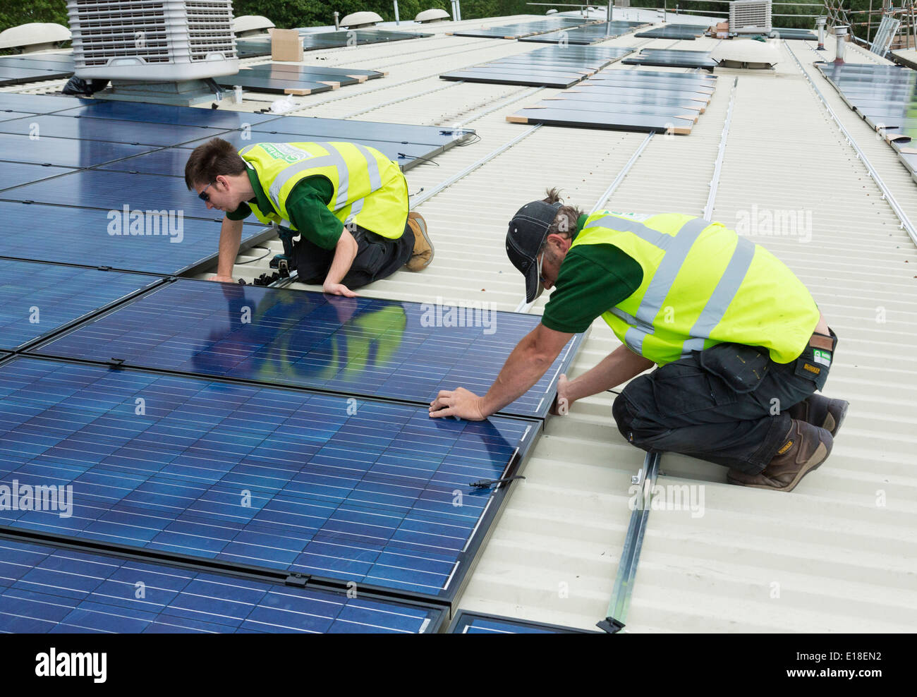 photovoltaic solar panels being installed on a roof Stock Photo Alamy
