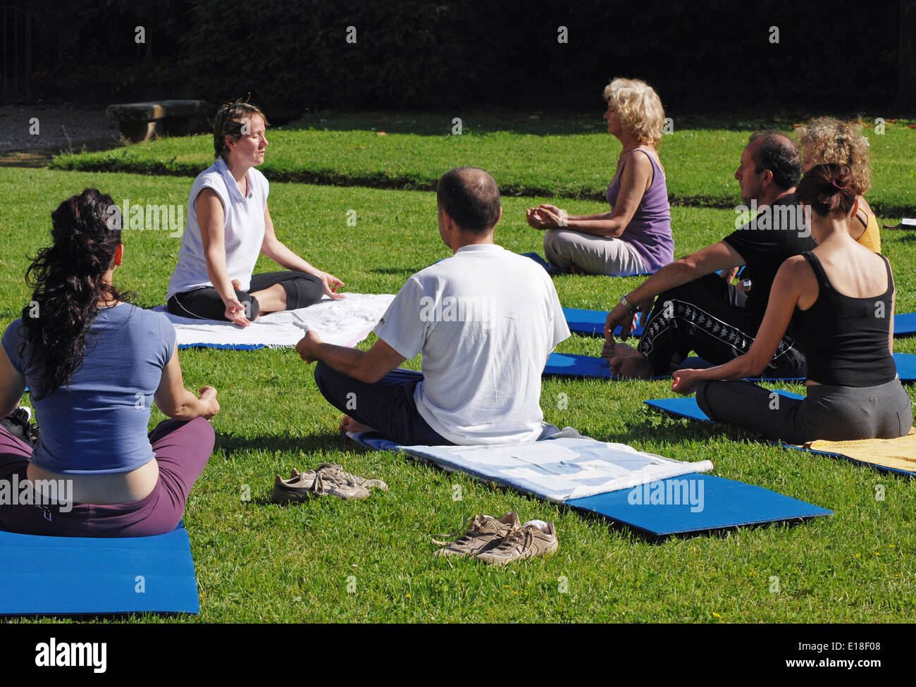 Yoga class in the park Stock Photo