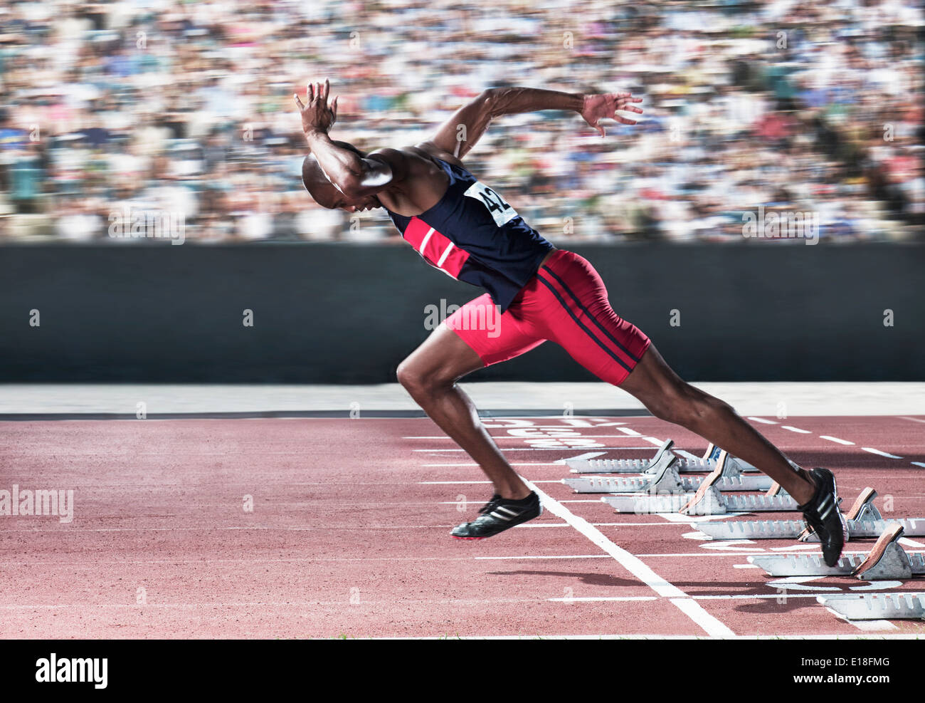 Sprinter taking off from starting block on track Stock Photo 69644080 Alamy