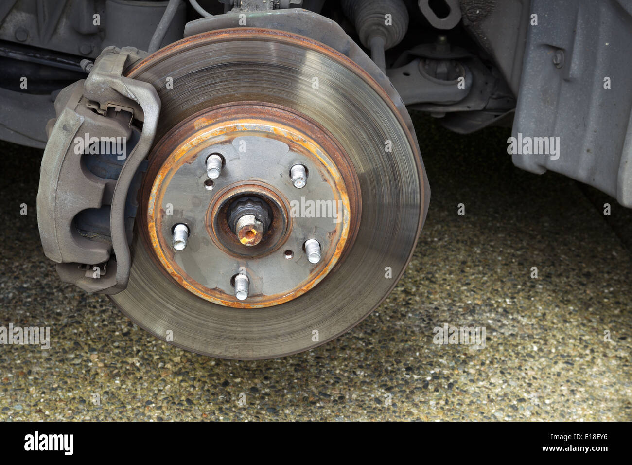 Closeup horizontal photo of exposed car brake drum and brakes inside of  wheel well Stock Photo - Alamy