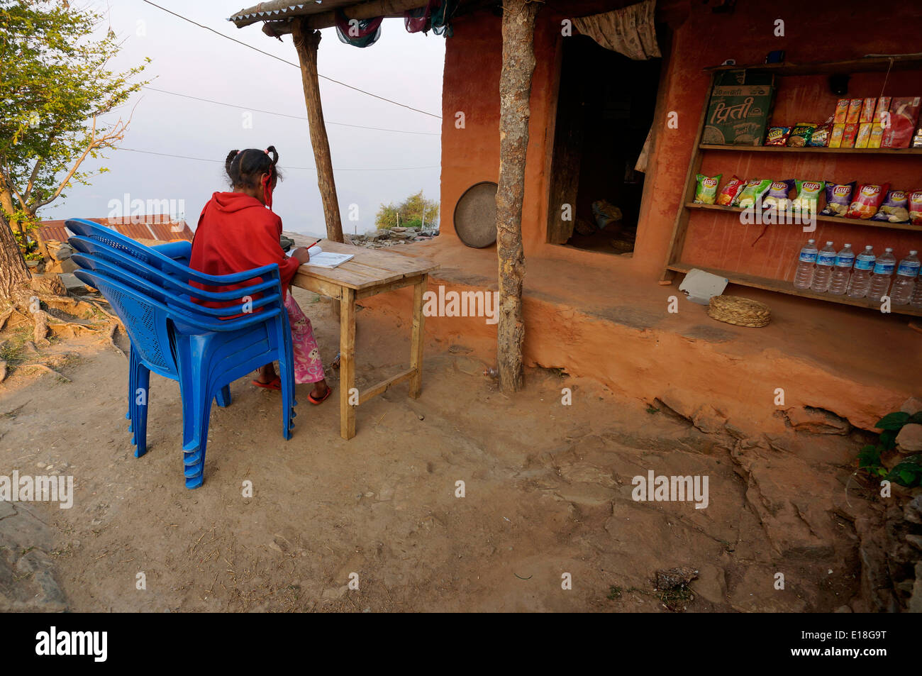 Children, Nepal,Asia,Young girl doing homework at home,candid  street, scenes photos,coldly, cute,this is life, photography Stock Photo