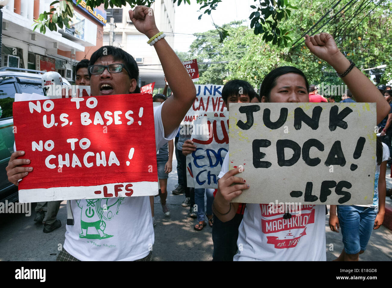 Manila, Philippines. 27th May, 2014. Student activists from the League of Filipino Students march along the side streets near the U.S. embassy in Manila to air their opposition against the EDCA. A group of student activists from the League of Filipino Students held a lightning rally near the U.S. embassy in Manila against the Enhanced Defense Cooperation Agreement. EDCA permits the U.S. military to set-up facilities in the Philippines. Credit:  J Gerard Seguia/Pacific Press/Alamy Live News Stock Photo