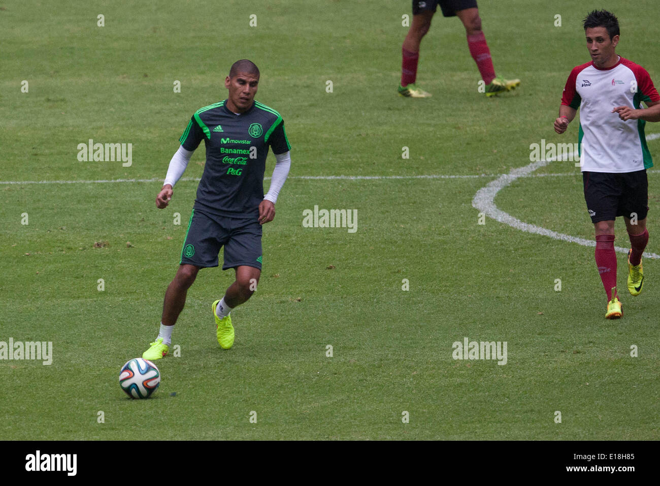 Mexico City, Mexico. 26th May, 2014. Player Carlos Salcido (L) of Mexico's national soccer team, takes part in a training session before the Brazil 2014 FIFA World Cup, in the Azteca Stadium, in Mexico City, capital of Mexico, on May 26, 2014. Credit:  Pedro Mera/Xinhua/Alamy Live News Stock Photo