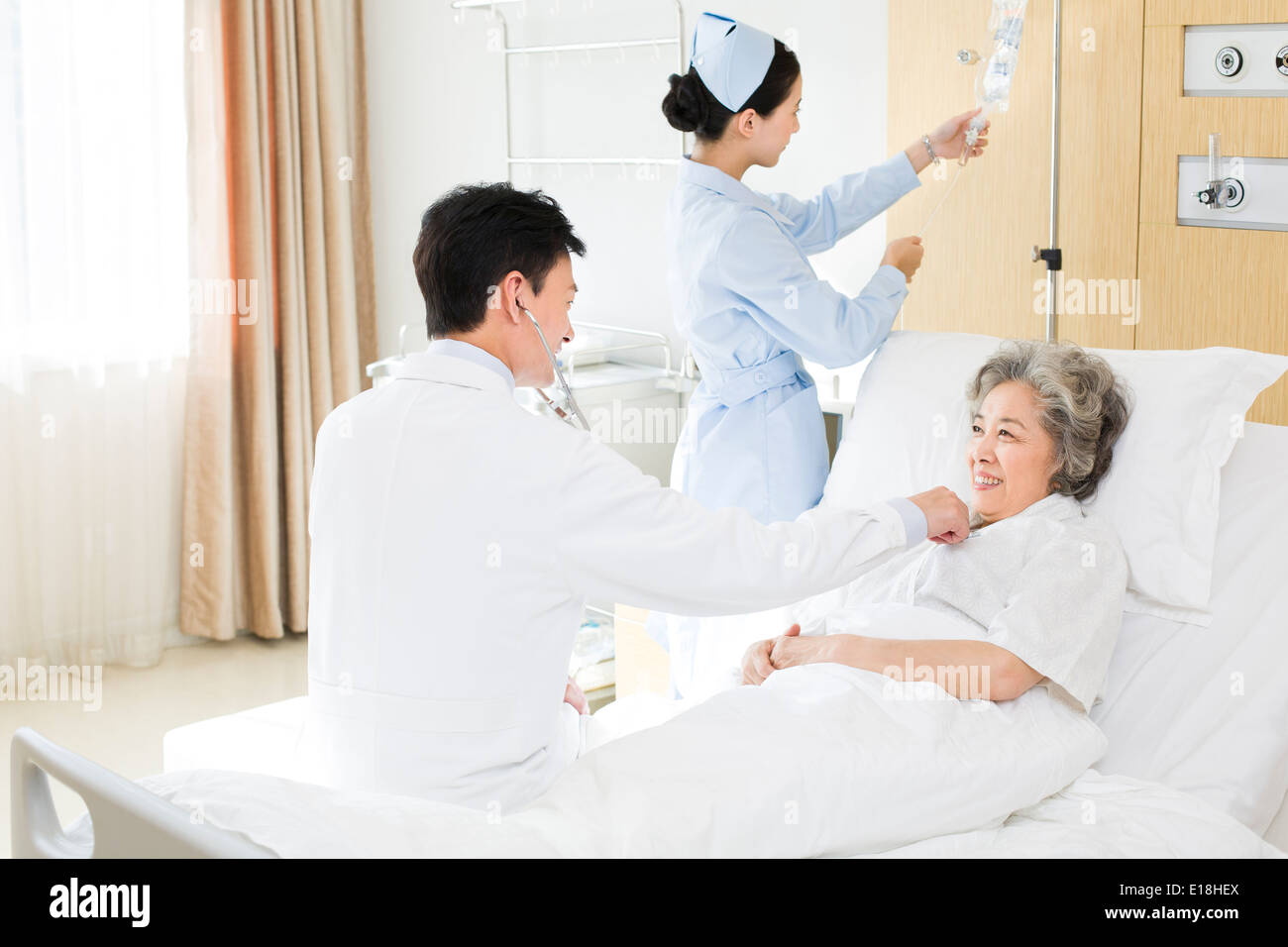 Doctor back using stethoscope hi-res stock photography and images - Alamy