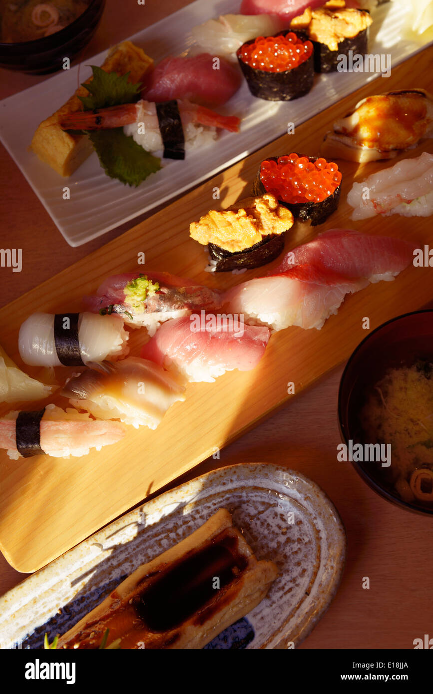 Artistic closeup of sushi plates at a Japanese restaurant. Tokyo, Japan. Stock Photo