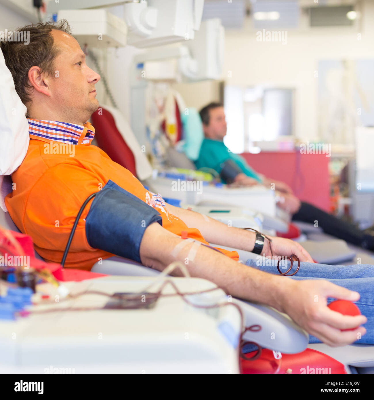 Blood donor at donation. Stock Photo