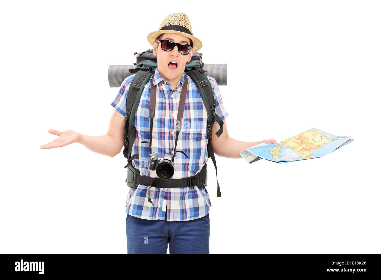 Lost male tourist holding a map and gesturing with hands Stock Photo