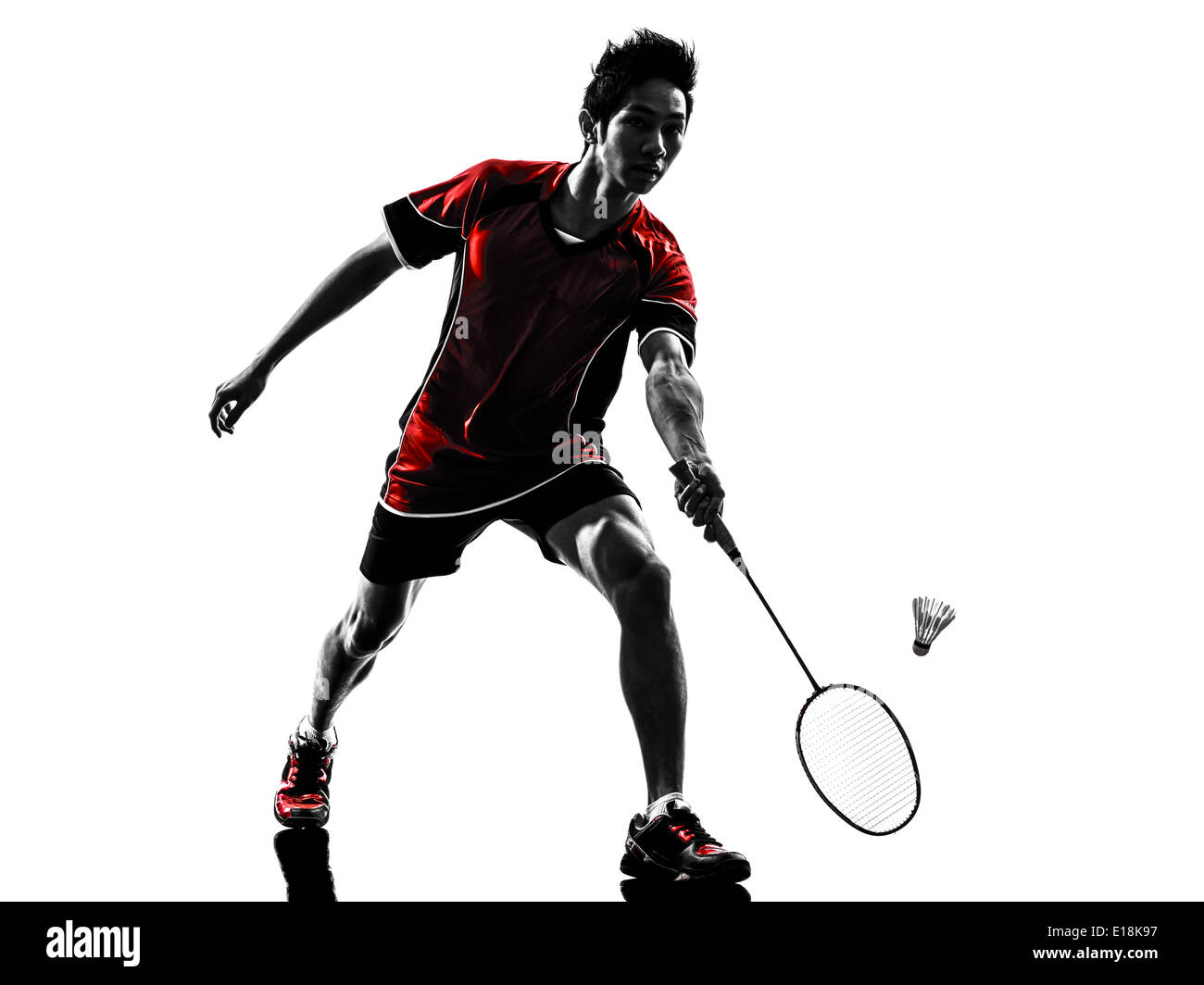 one asian badminton player young man in silhouette isolated white  background Stock Photo - Alamy