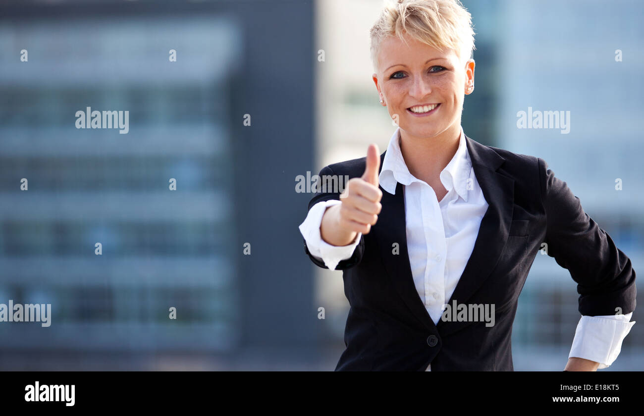 Attractive businesswoman shoing thumbs up Stock Photo