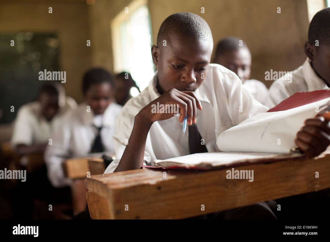 A student studies at a secondary school in Kakamega, Kenya, East Africa. Stock Photo