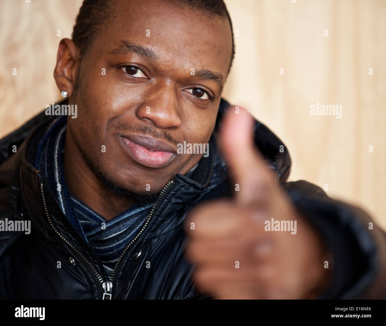 Black guy showing thumbs up Stock Photo Alamy