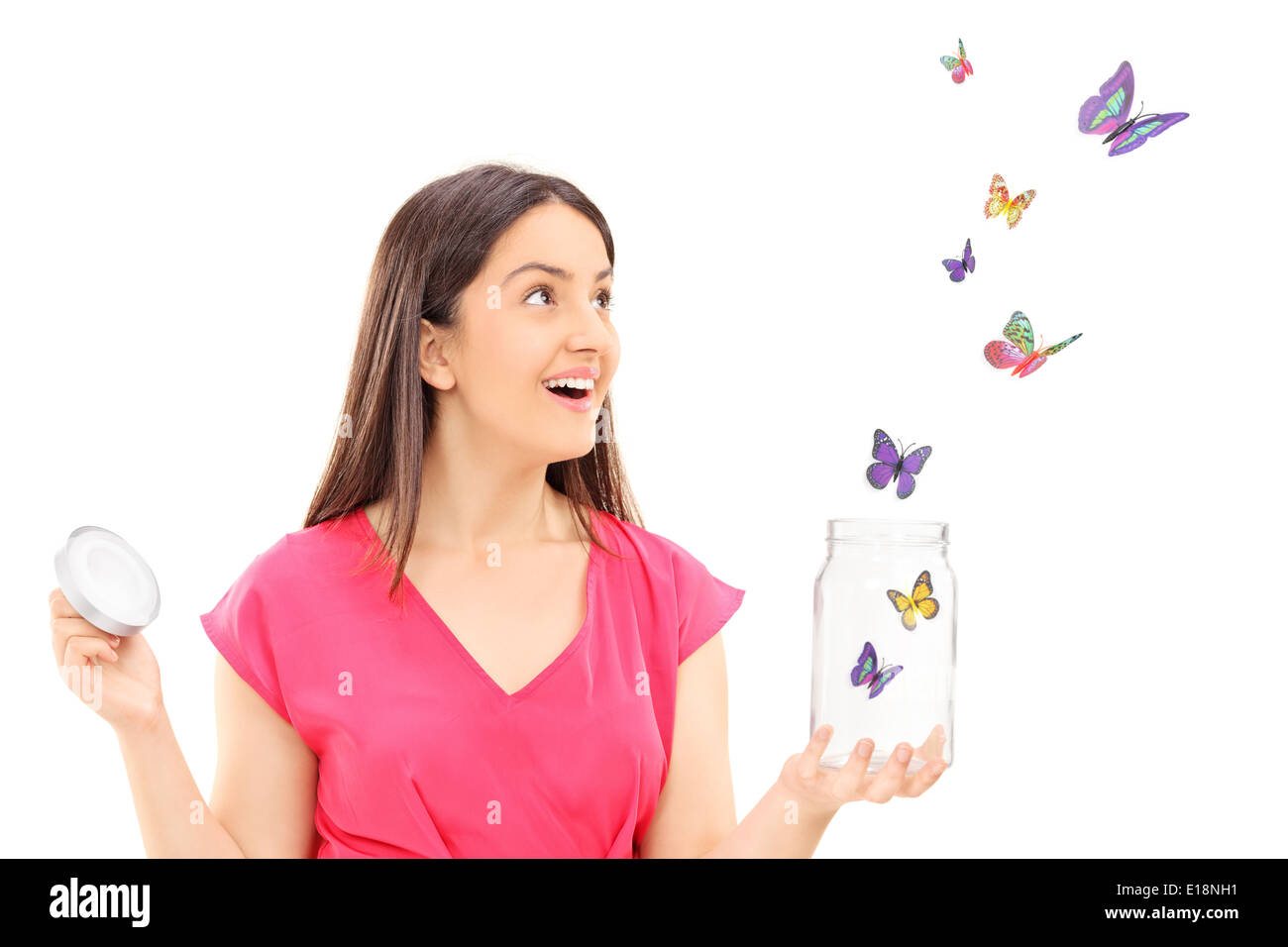 Happy girl watching butterflies escaping an open jar Stock Photo