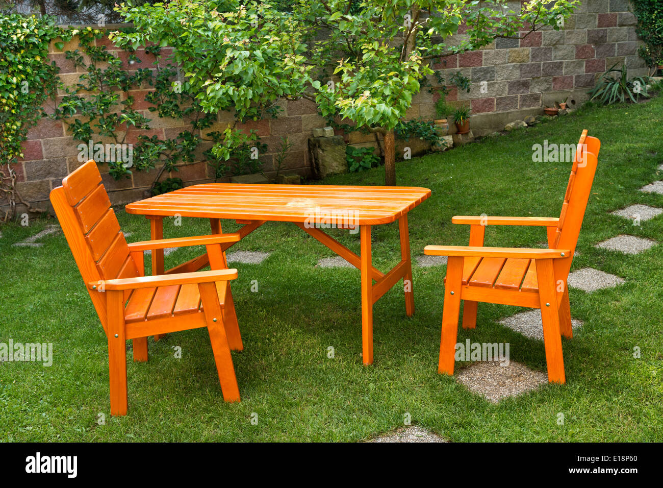 a deska and two chairs in the garden Stock Photo