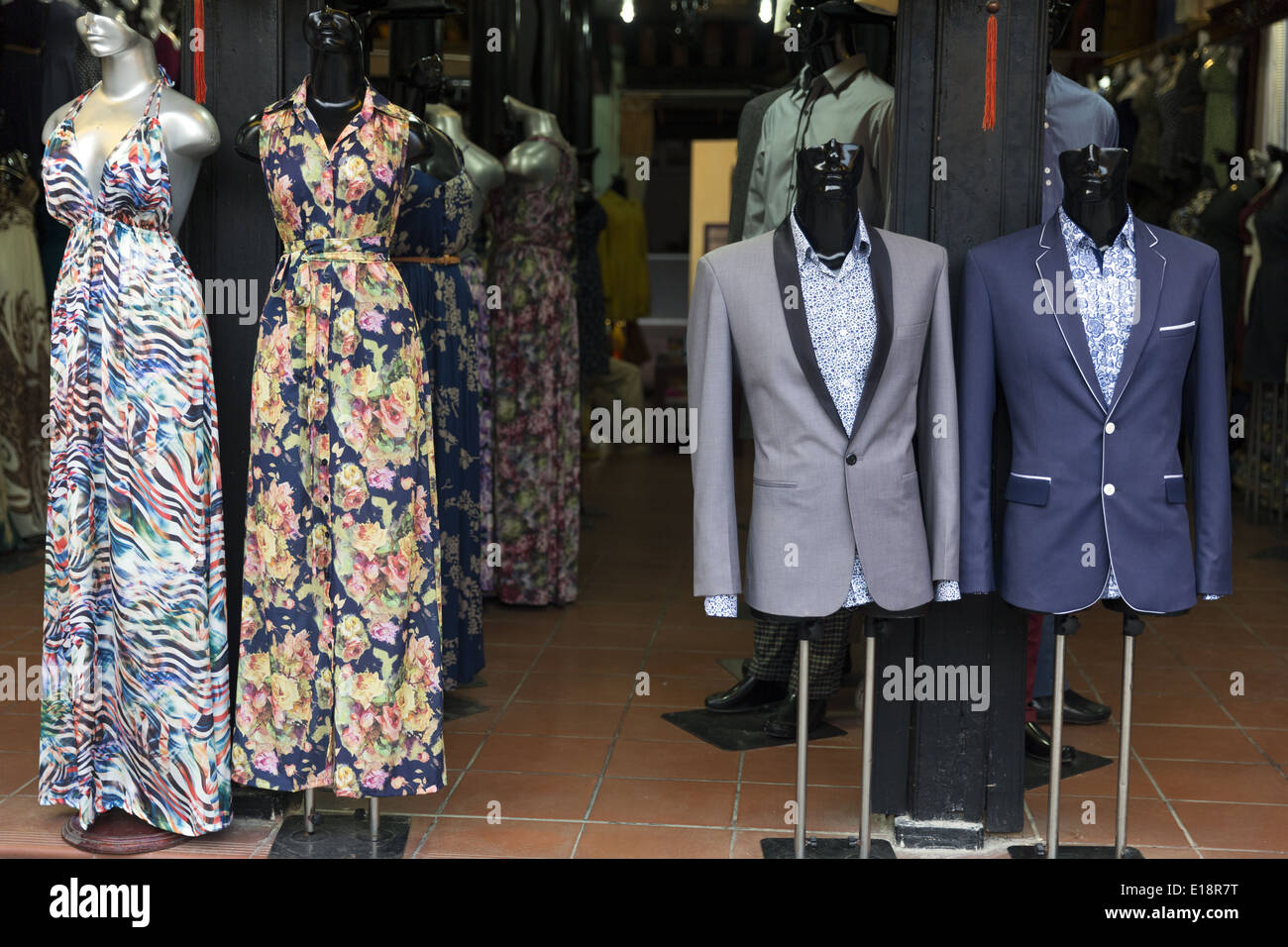 Mannequins with different clothing designs. Hoi An is a famous city for having a large number of tailor shops. Stock Photo