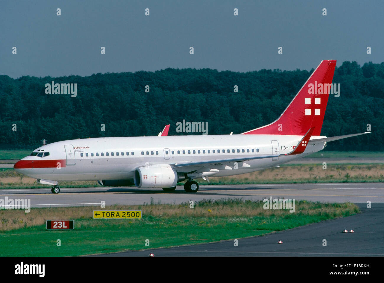 A Boeing 737-700 passenger aircraft of swiss airline PrivatAir is ready for departure at Dusseldorf-Lohausen airport, operating on behalf of german carrier Lufthansa. Stock Photo