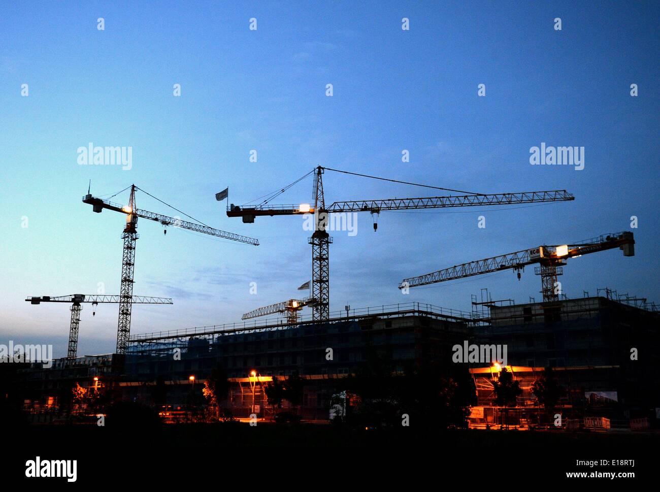 Construction cranes of a building site, captured on 21 May 2014 in Hamburg. Stock Photo