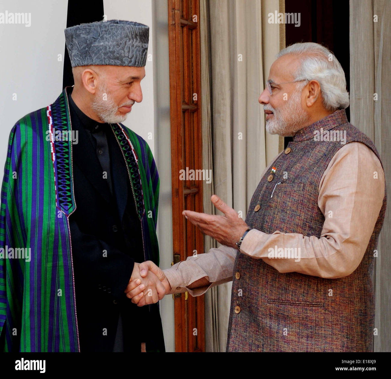 Shakes hands with afghan president hamid karzai hi-res stock 
