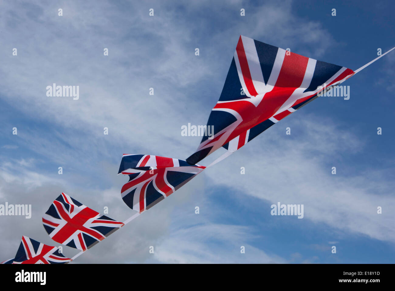 Union Jack Bunting flying on a windy spring day Stock Photo Alamy