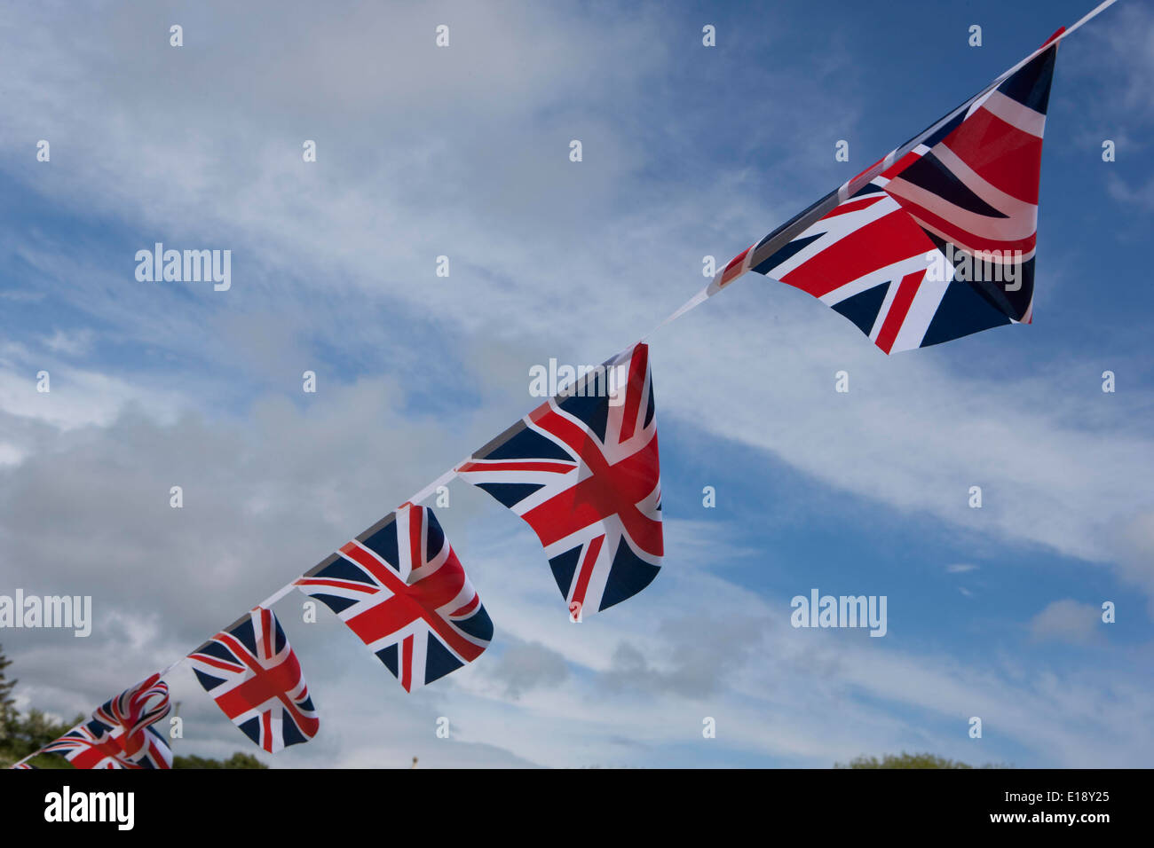Union Jack Bunting flying on a windy spring day Stock Photo Alamy