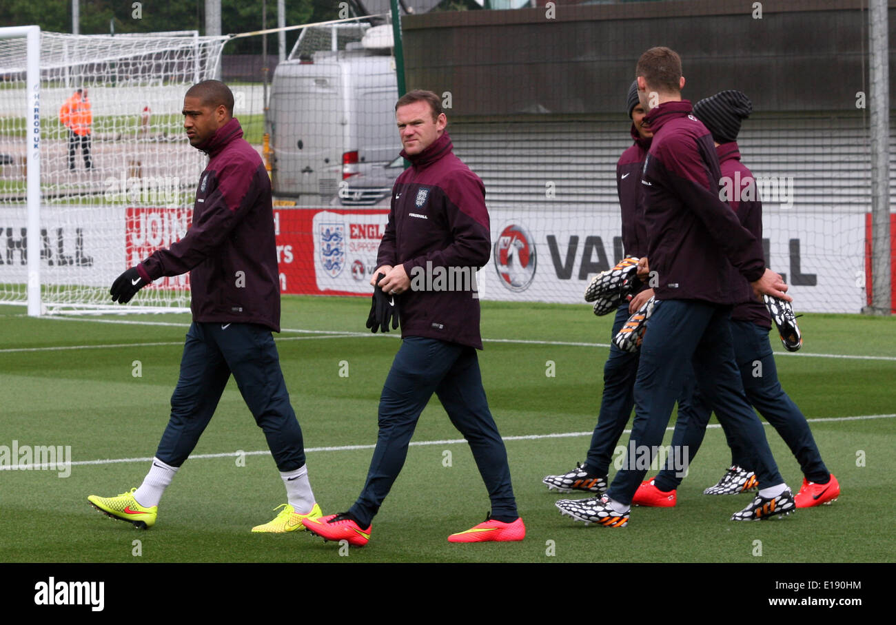Burton upon Trent, UK. 27th May, 2014. The players of team England Glen Johnson (L-R), Wayne Rooney and their teammates arrive for a practice session of the English national soccer squad in Burton upon Trent, Britain, 27 May 2014. Team England is preparing for the upcoming FIFA World Cup 2014 in Brazil. PHOTO: FLORIAN LUETTIKE/dpa Credit:  dpa picture alliance/Alamy Live News Stock Photo