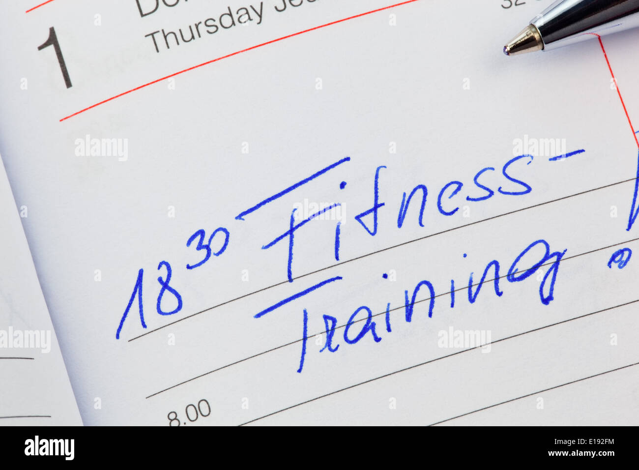 Ein Termin ist in einem Kalender eingetragen: Fitnesstraining Stock Photo