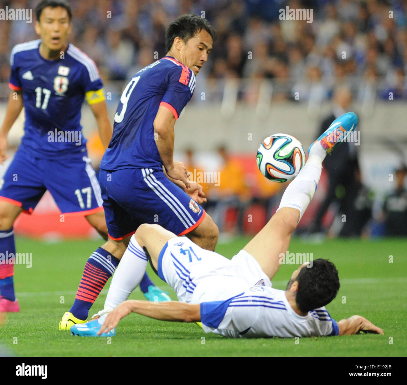 Tokyo, Japan. 27th May, 2014. Makato Hasebe (C) of Japan vies for the ball during Kirin Challenge Cup 2014 against Cyprus in Saitama, Japan, May 27, 2014. Japan won 1-0. © Stringer/Xinhua/Alamy Live News Stock Photo