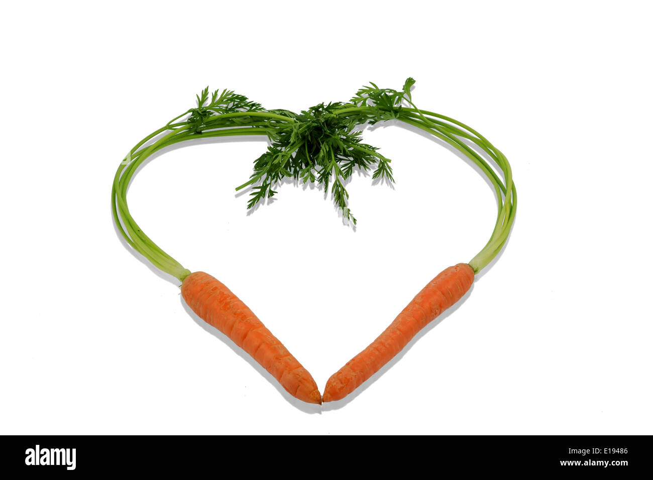 Ein Herz aus Mˆhren aus biologischem Anbau. Frisches Obst und Gem¸se ist immer gesund. Symbolfoto f¸r gesunde Ern‰hrung. Stock Photo
