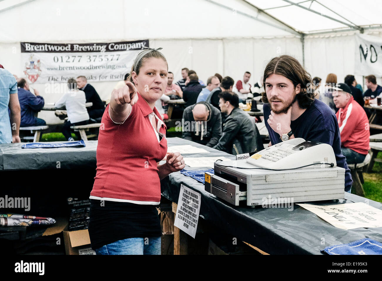A member of staff advising a customer at the Hoop Beer Festival. Stock Photo