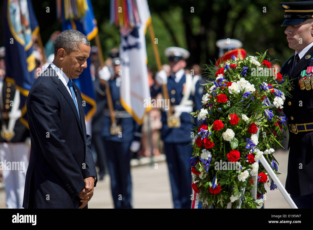 Arlington, Virginia. 26th May, 2014. United States President Barack Obama pauses after laying a wreath at the Tomb of the Unknown Soldier at Arlington National Cemetery, May 26, 2014 in Arlington, Virginia. President Obama returned to Washington Monday morning after a surprise visit to Afghanistan to visit U.S. troops at Bagram Air Field. Credit: Drew Angerer/Pool via CNP/dpa/Alamy Live News Stock Photo
