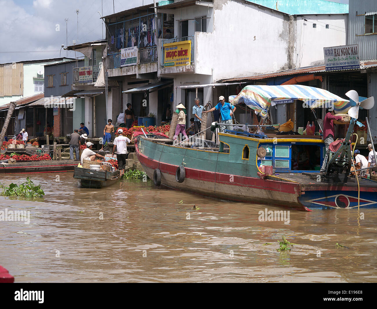 The Mekong River in Cambodia boats delivering produce to the factory Stock Photo