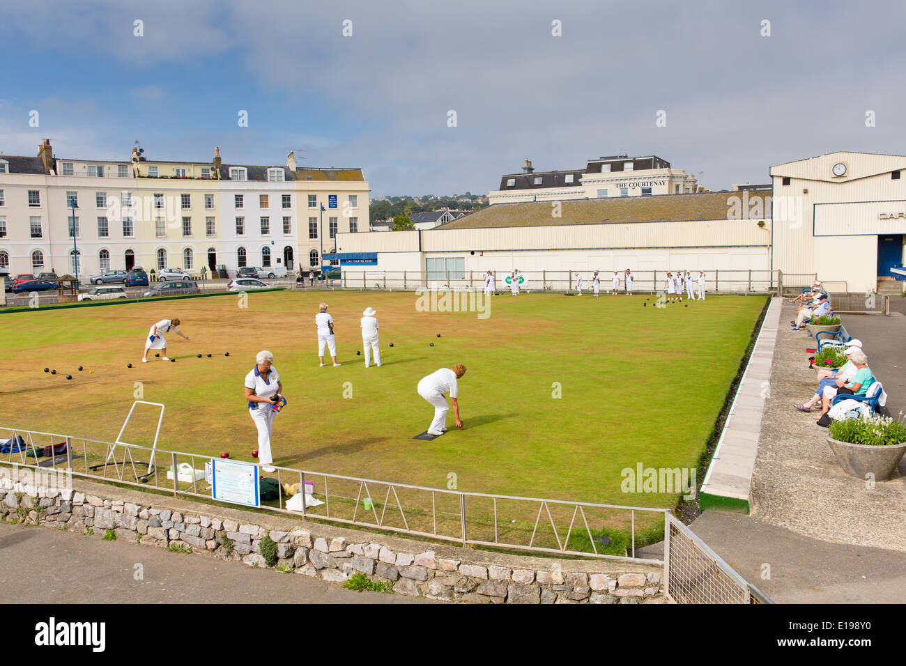 Bowls on bowling green Teignmouth Devon with players in white Stock Photo